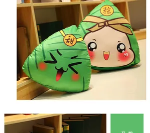 Detail of cute cartoon Zongzi plush toys with adorable expressions on a wooden shelf