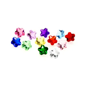 Close-up of 12 colorful star-shaped birthstone crystal glass beads for DIY jewelry making