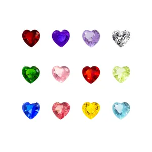 Macro view of twelve colorful heart-shaped faceted crystal gemstones in various shades