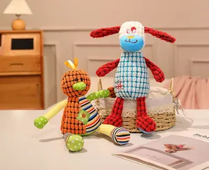 Cute textured plush animal toys featuring colorful patterns in a cozy room setting.