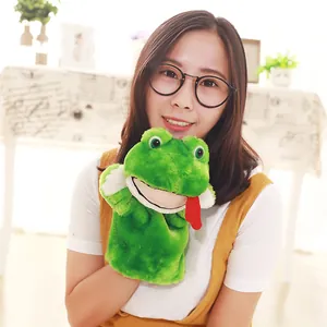 Close-up of a green plush frog hand puppet worn by a smiling woman for roleplay games