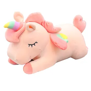 Soft pink plush unicorn pillow with rainbow horn and wings for kids room decoration