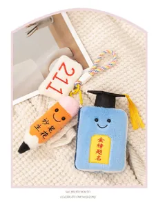 Close-up of cute plush school themed keychains for graduation gifts