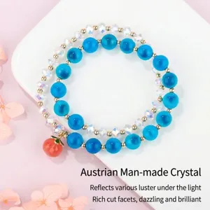 Elegant double-layer blue crystal beaded bracelet with red peach charm for women