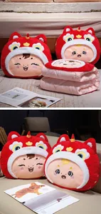 Detail view of cute red lion dance pillow and pink folded blanket set for office nap use