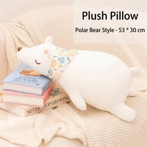 Soft plush polar bear throw pillow with floral scarf sleeping on a stack of books