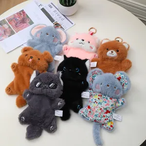 Detailed shot of various cute cartoon plush animal keychains with fluffy textures