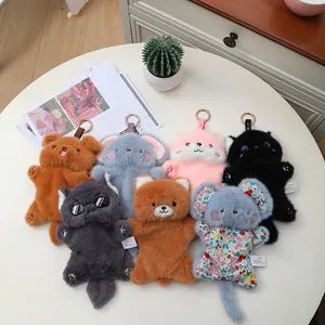 A collection of cute plush animal hand warmer keychains in various colors and designs