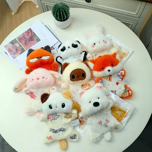 Collection of cute plush animal hand warmers including fox rabbit and panda characters.