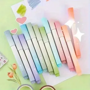 Close-up of 12-pack pastel gradient highlighter pens in soft Morandi colors on a desk.