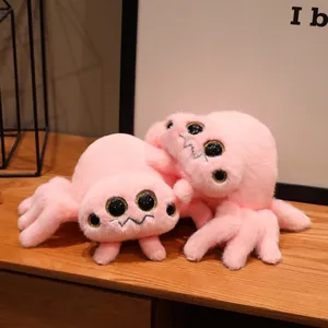 Adorabile peluche a forma di ragno rosa con occhi scintillanti in un ambiente domestico