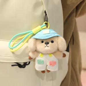 Süßer Plüschhund-Schlüsselanhänger für Rucksäcke mit „Hand Made“-Etikett und blauem Hut