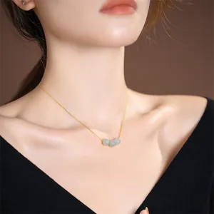 Elegant S925 silver necklace with three green jade beads on a delicate gold box chain