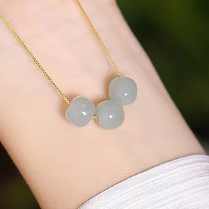 Elegant S925 sterling silver necklace with Hetian jade beads on a delicate box chain.