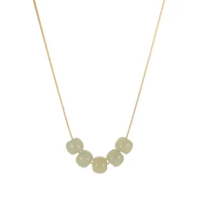 Minimalist S925 silver necklace with five pale green Hetian jade style beads on a gold box chain.