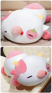 Detailed macro view of a large strawberry pig-cow plush toy pillow on a chair