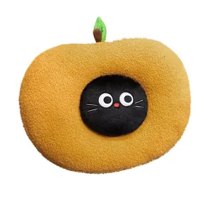 Cute apple-shaped plush pillow with a black cat face and soft texture