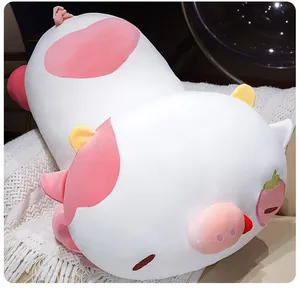 Detailed side view of a large cute white and pink strawberry pig cow plush toy