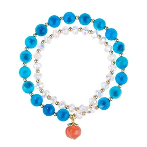 Exquisite double-layer beaded bracelet featuring blue agate beads and an orange peach pendant