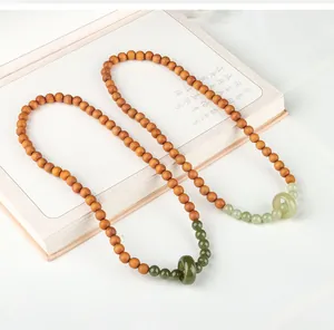 Double-layered sandalwood and jade bead necklace with decorative jade ring pendant