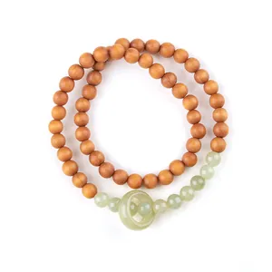 Elegant double-strand sandalwood bracelet with nephrite jade beads and a central run ring