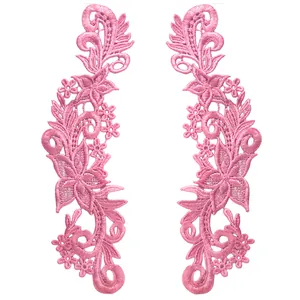 Detailed view of pink water-soluble floral lace embroidery patch with hollow design