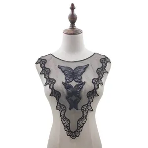 Detailed view of black water-soluble lace collar with butterfly embroidery on mannequin