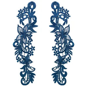 Macro detail of navy blue water soluble lace appliques with floral embroidery