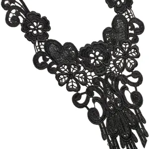 Macro detail of black water-soluble lace collar with intricate floral embroidery