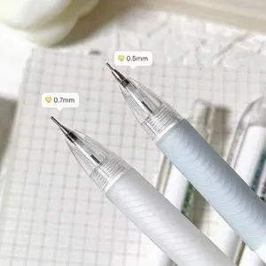 Macro detail of 0.5mm and 0.7mm mechanical pencil tips shown on textured paper surface