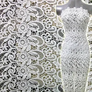 Detailed view of high-grade white water-soluble lace fabric with intricate floral embroidery