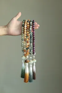 Detailed view of traditional Chinese style lotus Bodhi bead bracelets with tassels