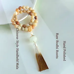 Hand-held double-strand Bodhi root beaded bracelet with lotus charm and tassel