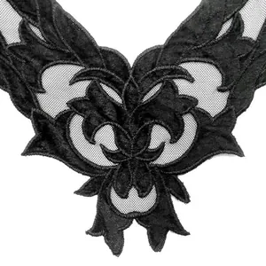 Close-up of black water-soluble lace collar with velvet embroidery and mesh detail