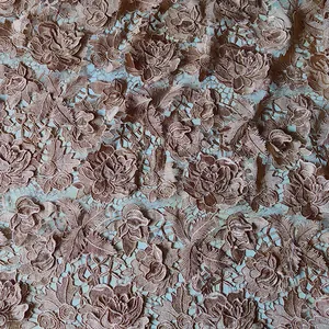 Close-up of 3D hollow water-soluble lace embroidery fabric with rose floral pattern