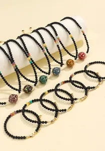 Detailed view of handmade black onyx bead necklaces with large colorful lacquer beads