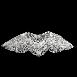 Detailed view of intricate white lace embroidery on a Hanfu style shawl collar