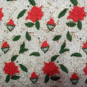 Detail of high-end water-soluble lace fabric with 3D red rose floral embroidery