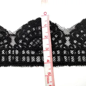 Close-up of black mesh embroidered lace trim with a tape measure showing 5cm width