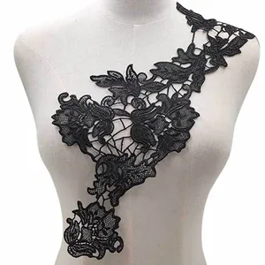 Detailed view of black water-soluble lace neck flower with 3D floral embroidery pattern