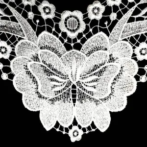 Detailed macro view of white water-soluble butterfly lace collar embroidery for apparel decoration