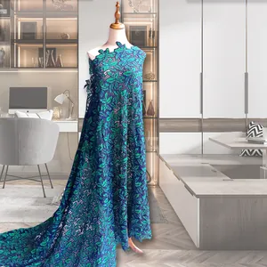 Detail view of dual-tone leaf embroidered water-soluble lace fabric on mannequin