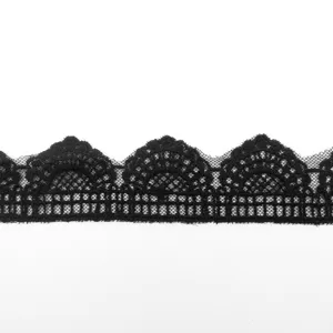 Detailed macro view of black scalloped mesh embroidered lace trim for DIY sewing