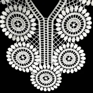 Close-up showing intricate texture of white water-soluble lace floral collar detail