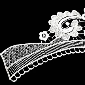 Close-up detail of white water-soluble lace embroidery collar flower pattern.