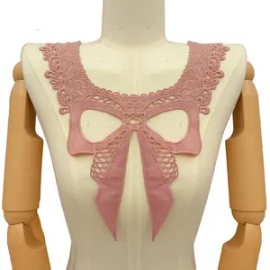 Detail view of pink milk silk lace collar with intricate hollow bow embroidery on mannequin.