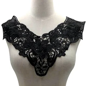 Detail view of black water-soluble lace collar with 3D floral embroidery on mannequin.