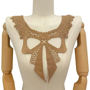 Detailed close-up of a beige milk silk embroidered lace collar with a 3D hollow bow.
