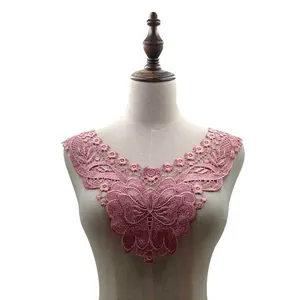 Detail of pink water-soluble lace collar with butterfly embroidery on mannequin