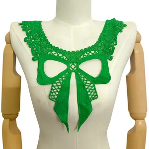 Close-up detail of a bright green water-soluble lace bow collar applique on white mannequin